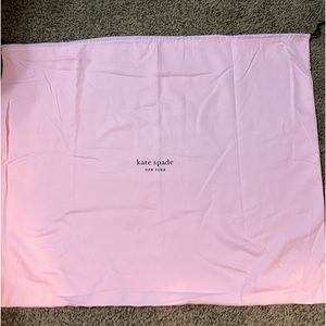 Kate Spade drawstring laundry bag pink with green Kate Spade logo on front